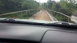 Crossing a narrow bridge on the way to Rainmaker